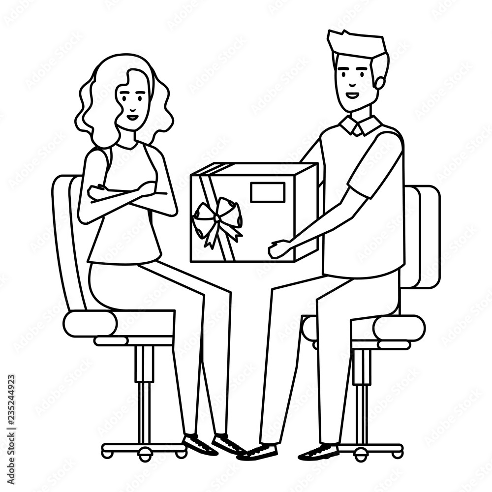 business couple sitting in chairs giving gift