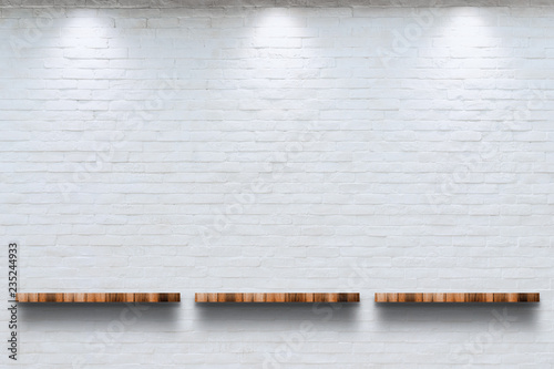 Empty top of wooden shelf with white brick wall background. photo