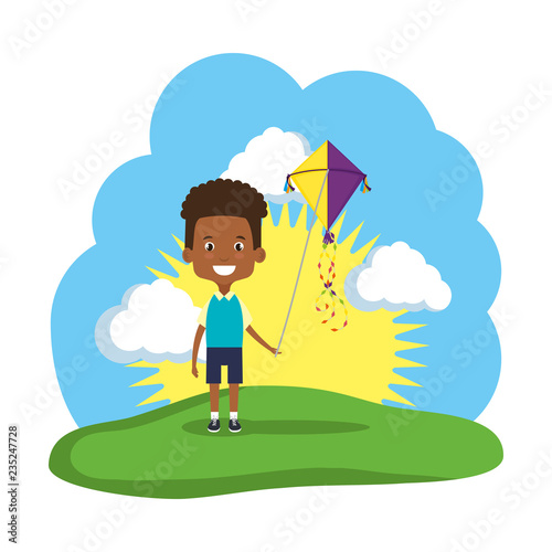 little black boy flying kite in the field
