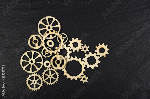 Gears on black background. Conceptual image of industry, mecanics, connection or team work.  photo