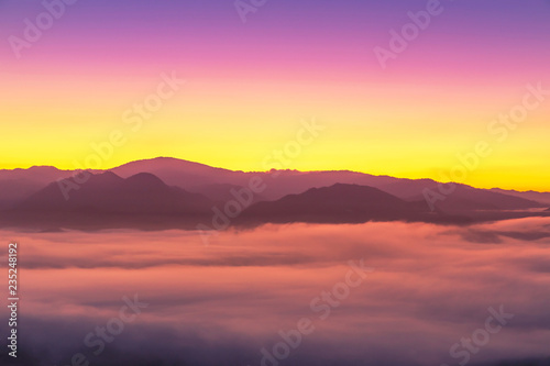 Landscape view of sunrise with white fog in early morning on the top of the hill at yun lai viewpoint, pai, Mae Hong Son, thailand