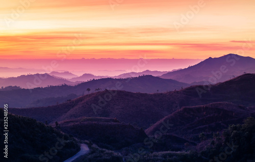 Colorful landscape view in early morning before the sunrise with misty covered mountain hills at Thong Pha Phum. Kanchanaburi, Thailand