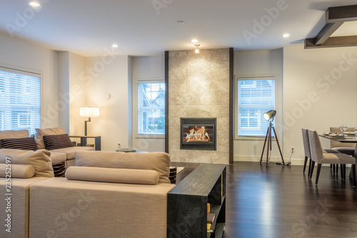 Spacious bright living room and dining room with a fireplace. Interior design.
