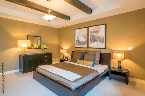 Fotografie Modern bright bedroom interior with designer pillows in a luxury house, hotel