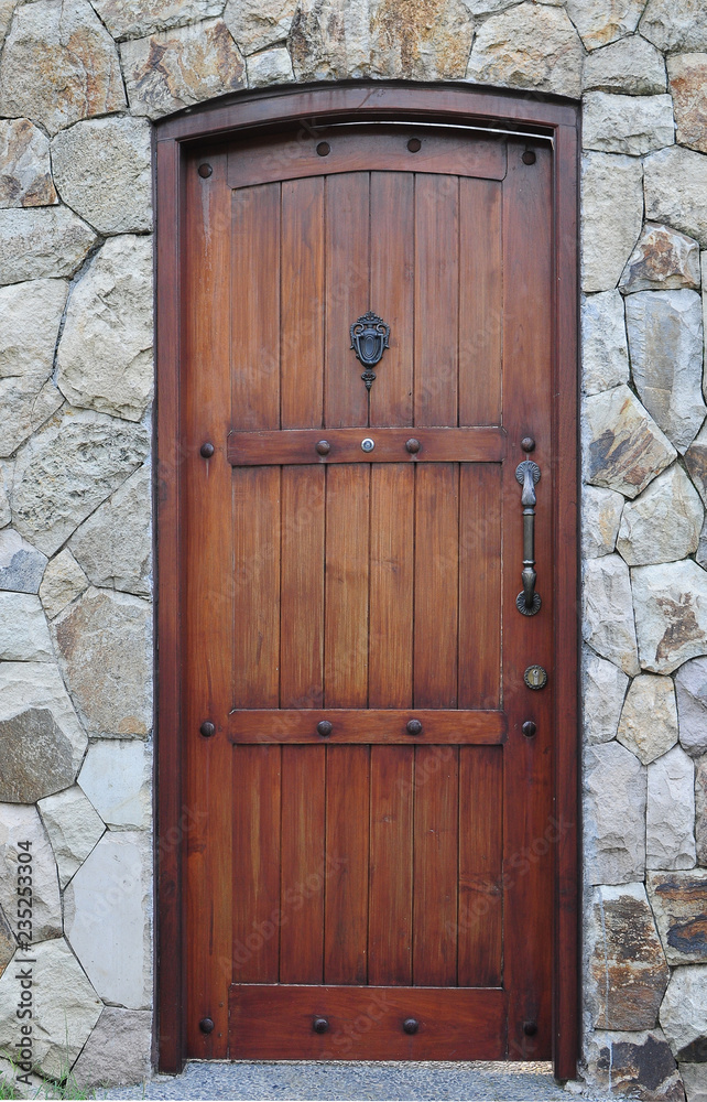 classic wood door with natural stone background