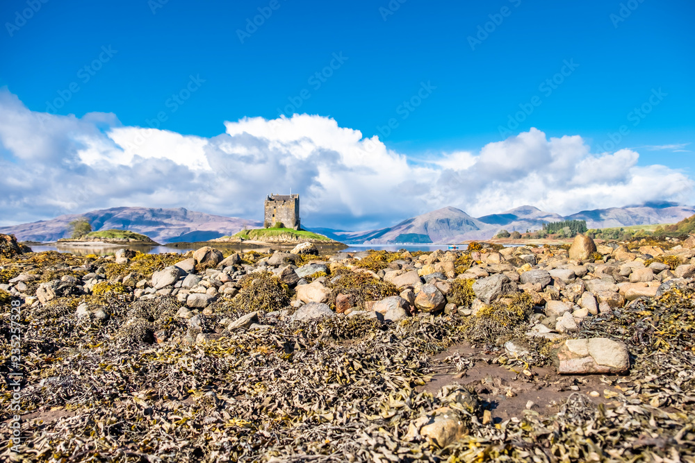 View of the Castle Stalker in autumn on the low tide near Port Appin, Argyll - Scotland View of the Castle Stalker in autumn on the low tide near Port Appin, Argyll - Scotland