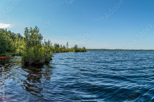 A picturesque lake with water of a reddish hue