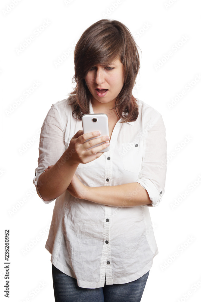 open-mouthed young woman staring at smartphone in disbelief or shock open-mouthed young woman staring at smartphone in disbelief or shock