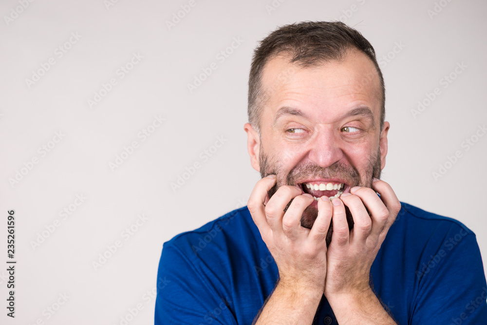 Man biting his nails