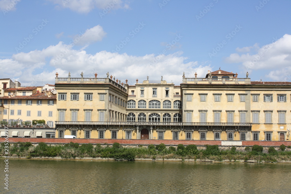 Cityscape view on the riverside with the old buildings and palaces (Florence Italy)
