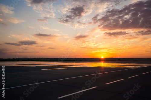 Airport runway in the evening sunset light © Media_Works