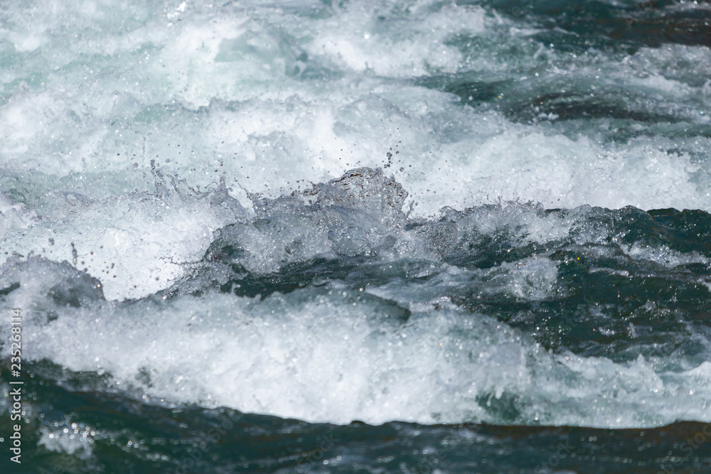 Water mountain river and the wonderful rocky creek. Water Drops after splash. Closeup macro view Water mountain river and the wonderful rocky creek. Water Drops after splash. Closeup macro view