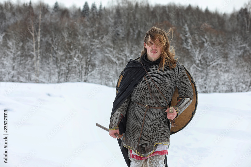 Fototapeta premium Defender the young warrior in mail armor