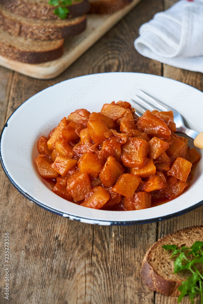 Stewed zucchini with onions and tomato sauce in a bowl Stewed zucchini with onions and tomato sauce in a bowl