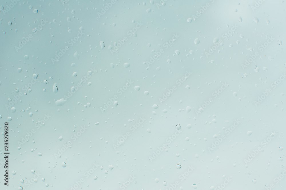 Water drops on a window background, soft focus Water drops on a window background, soft focus