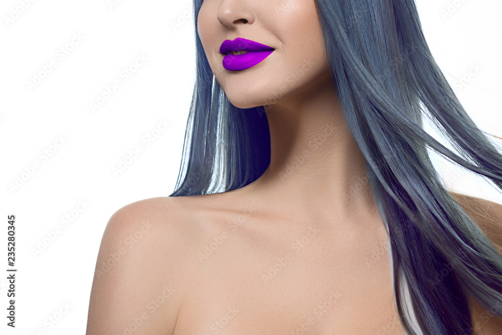 Close-up creative makeup image of sexy full lips and blue hair. Purple lip gloss on pale clear skin. Beauty dolls, cosmetological skin care, beauty salon, creative cosmetics Close-up creative makeup image of sexy full lips and blue hair. Purple lip gloss on pale clear skin. Beauty dolls, cosmetological skin care, beauty salon, creative cosmetics