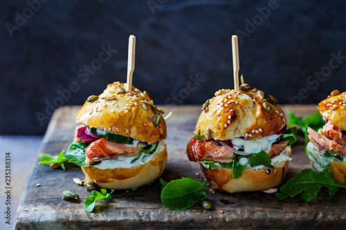 Brioche buns with hot smoked salmon, beetroot, salad and yogurt dressing photo