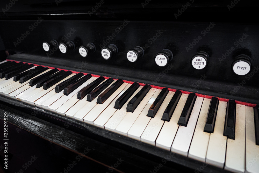 Detail of the keyboard of an ancient organ. Detail of the keyboard of an ancient organ.