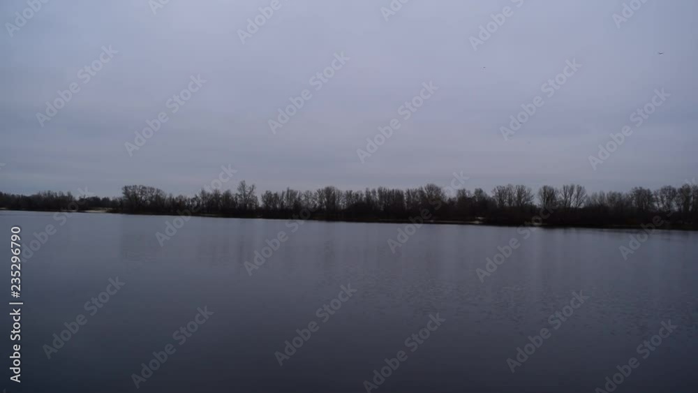 Fabulous dark landscape of the river and the dry forest. Fabulous dark landscape of the river and the dry forest.