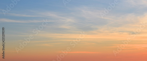 Sunset and sunrise sky. Bright orange and blue color. Early morning background. © Oksana Zhigulina	