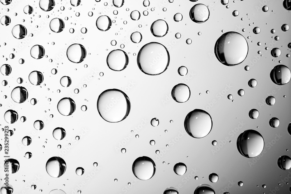 Dripped water on glass. Gray chrome abstract background