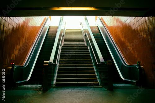 Close-up of the escalator at the metro station. Steps in motion. photo