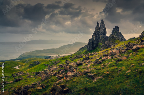 Landscape view of Old Man of Storr rock formation, dramatic clouds, Scotland