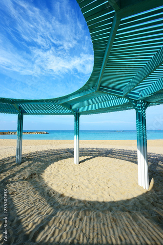Fototapeta Naklejka Na Ścianę i Meble -  Solar canopy on the beach of Mediterranean sea.