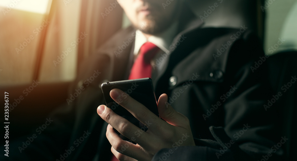 Young handsome businessman sitting in the car Young handsome businessman sitting in the car