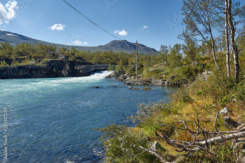 blaues Wasser am Ufer in Maurvangen photo