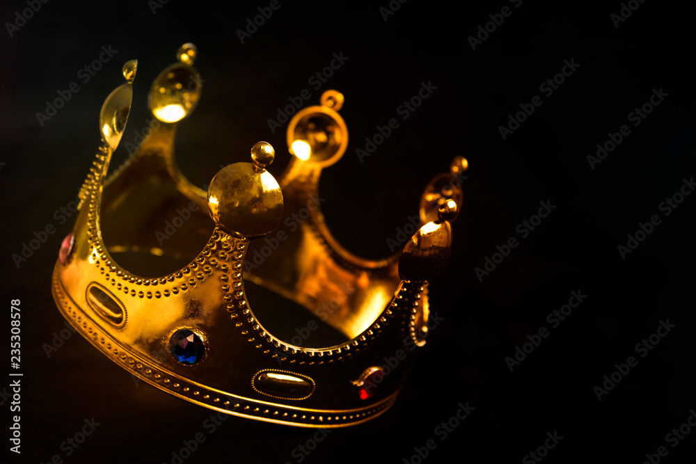 gold Royal crown on black background. symbol of power. domination. Stock  Photo | Adobe Stock