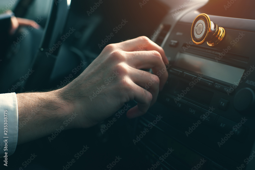 Close-up - Businessman at the wheel of new car