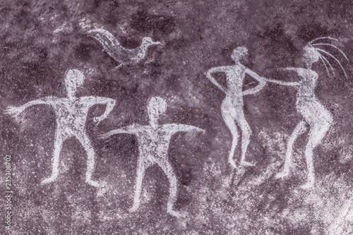 the image of ancient people on the wall of the cave, the history of antiquities archeology.