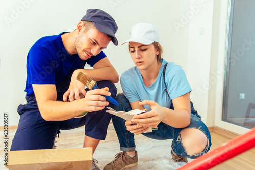 Couple selecting color for wooden furniture