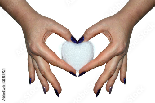 Fluffy heart in the female palms on a white background