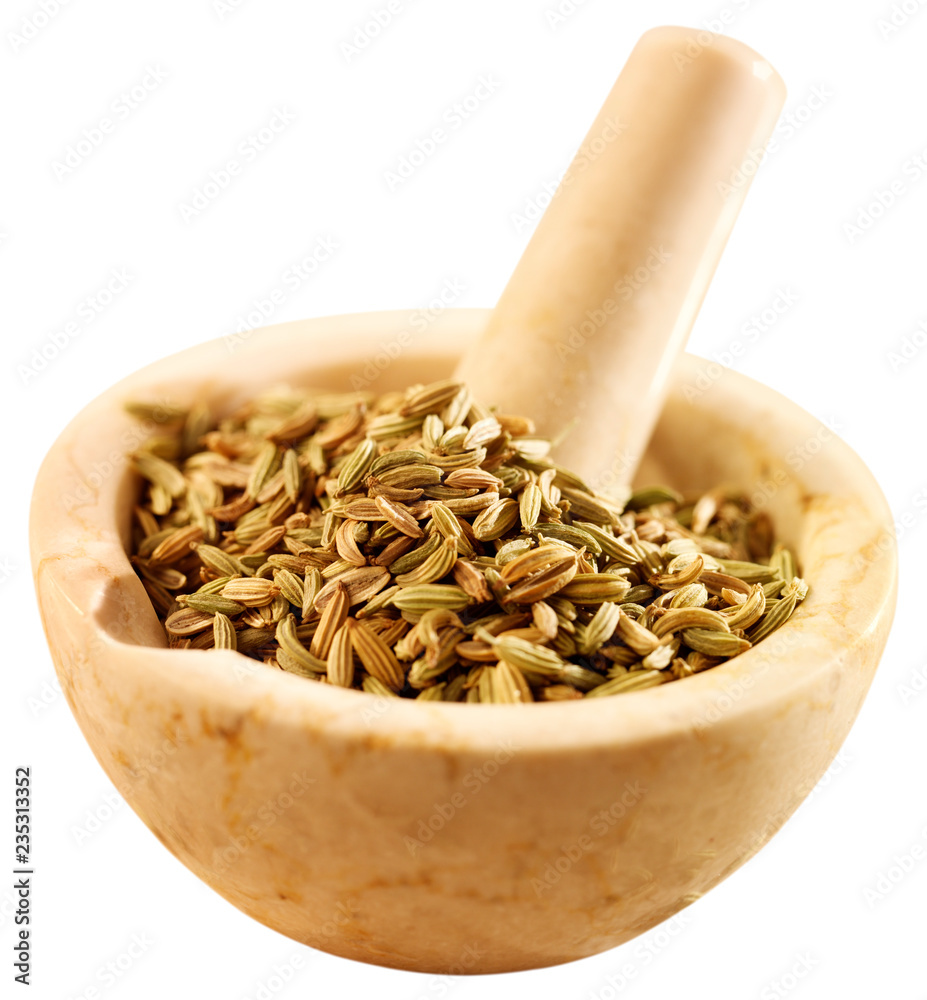 FENNEL SEEDS IN PESTLE AND MORTAR CUT OUT FENNEL SEEDS IN PESTLE AND MORTAR CUT OUT