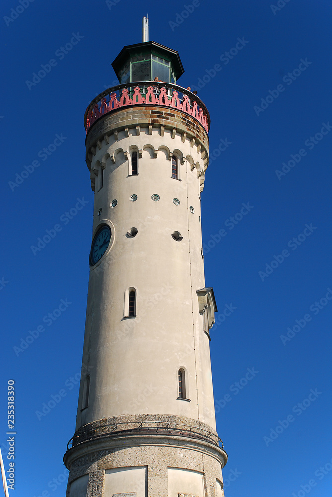 Harbour entrance of Lindau, Lake Constance (German: Bodensee) with the new lighthouse and the Bavarian Lion Harbour entrance of Lindau, Lake Constance (German: Bodensee) with the new lighthouse and the Bavarian Lion
