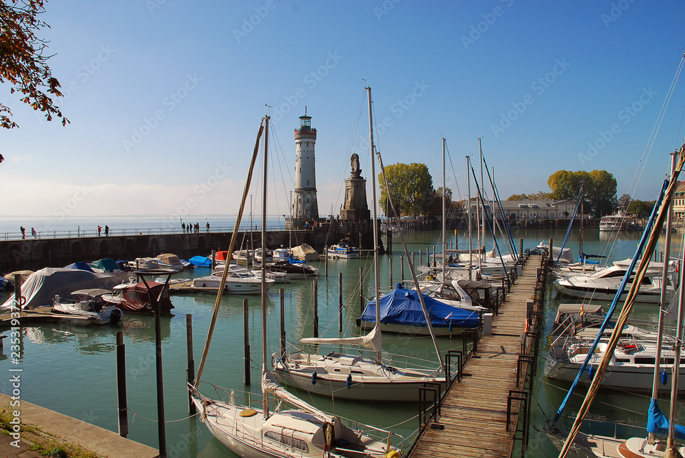 Harbour entrance of Lindau,  Lake Constance (German: Bodensee) with the new lighthouse and the Bavarian Lion