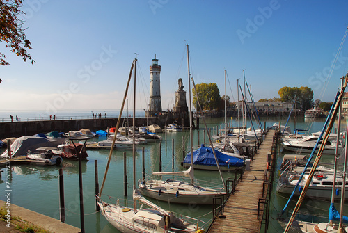 Harbour entrance of Lindau, Lake Constance (German: Bodensee) with the new lighthouse and the Bavarian Lion