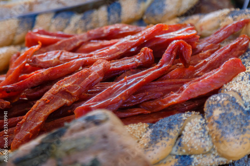 Smoked meat and bread for sale on market. photo