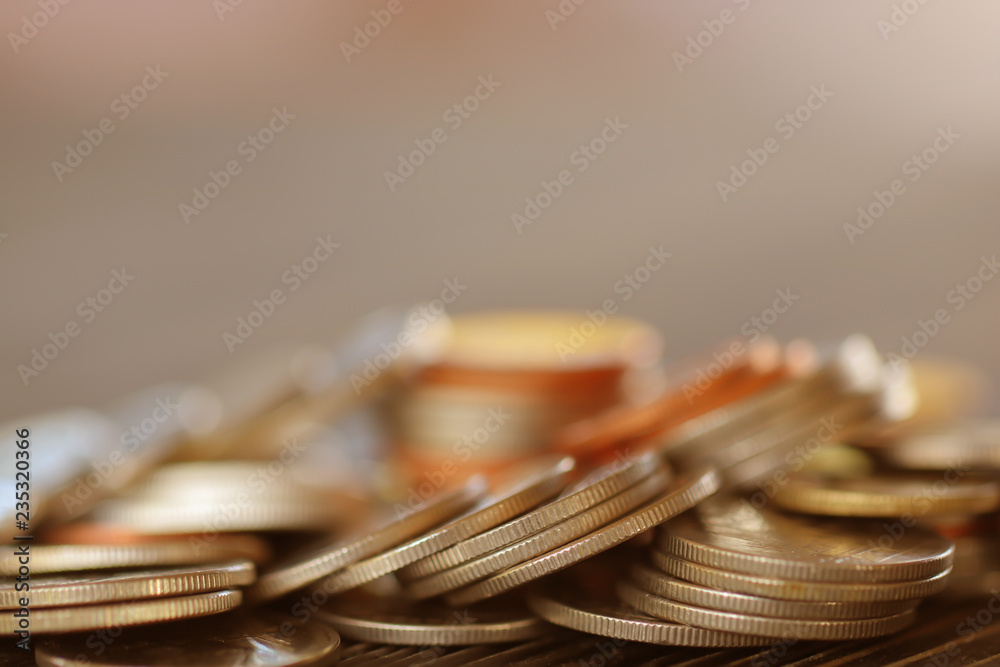 Row of coins on wood background for finance and Saving concept,Investment, Economy, Soft focus and dark style. Row of coins on wood background for finance and Saving concept,Investment, Economy, Soft focus and dark style.