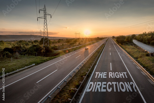 Beautiful Countryside Motorway with a Single Car at sunset with motivational message The Right Direction
