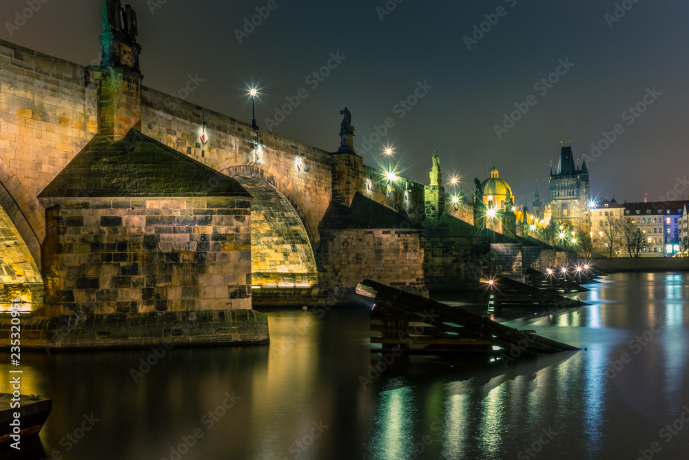 View of the Charles Bridge and Vltava river in Prague in a cold winter night - 4