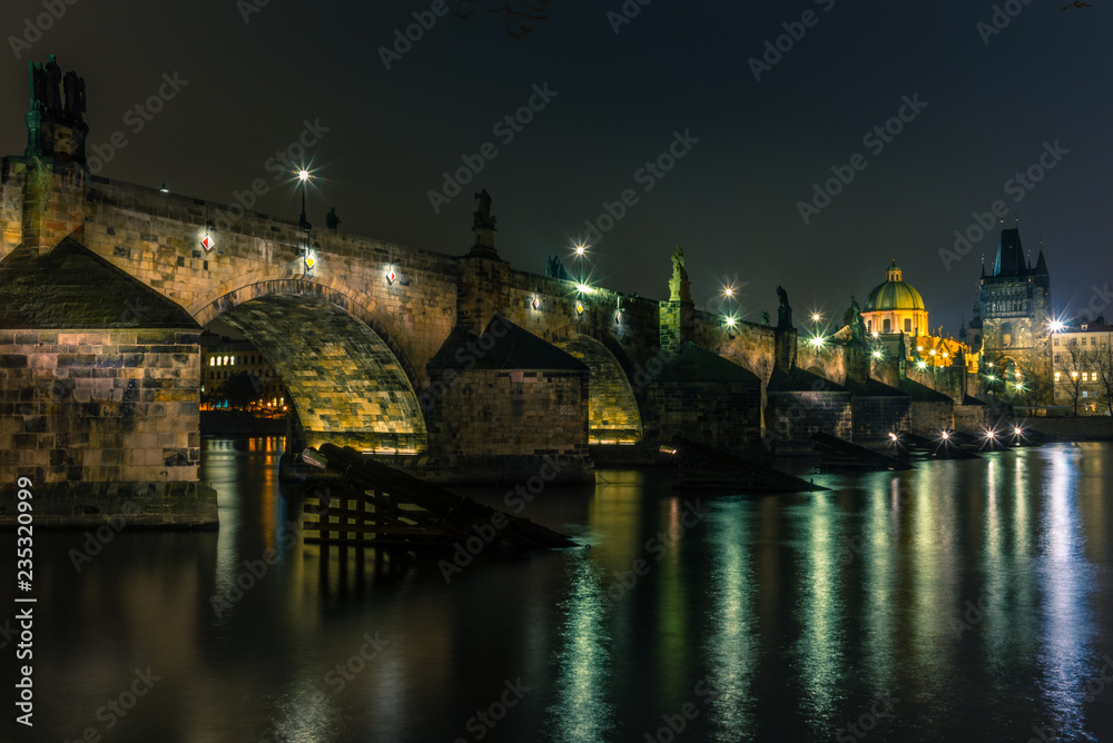 View of the Charles Bridge and Vltava river in Prague in a cold winter night - 2