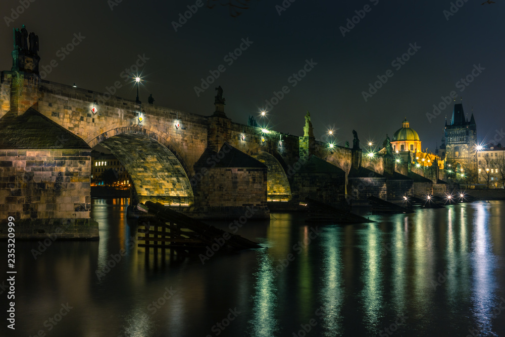 View of the Charles Bridge and Vltava river in Prague in a cold winter night - 2 View of the Charles Bridge and Vltava river in Prague in a cold winter night - 2