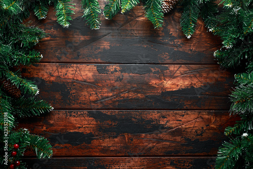 Christmas background with fir tree and decoration on rustic wooden table