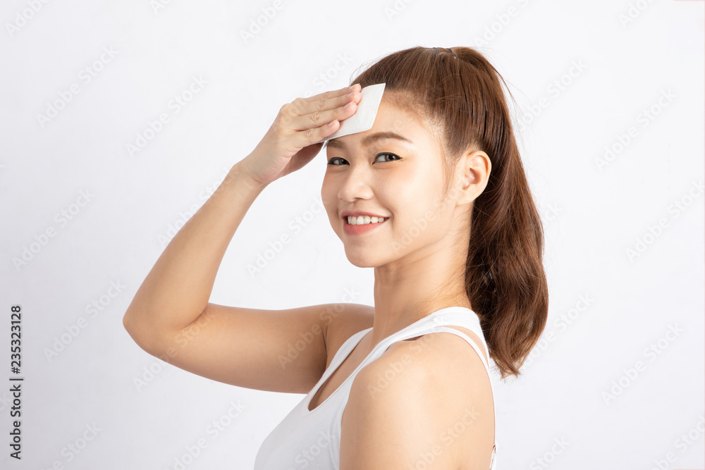 Attractive Charming Asian young woman smile and using tissue with toner for cleaning make up feeling so fresh and clean with healthy skin,isolated on white background,Beauty Cosmetics Concept Attractive Charming Asian young woman smile and using tissue with toner for cleaning make up feeling so fresh and clean with healthy skin,isolated on white background,Beauty Cosmetics Concept