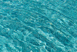The surface of the water reflection in the pool.
