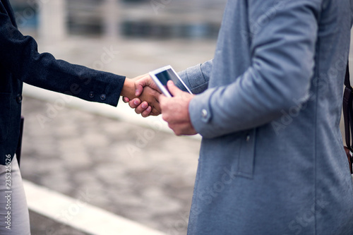 Business people shaking hands,cropped shot