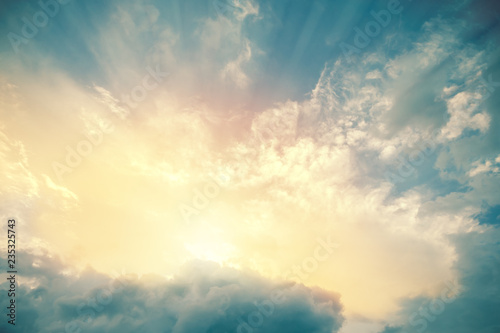 Heavenly view of sun beams lighting turquoise blue sky. For background and wallpaper